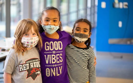 a group of girls with face paint