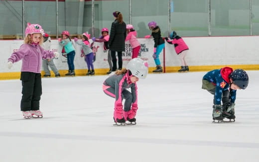 a group of kids on ice skates