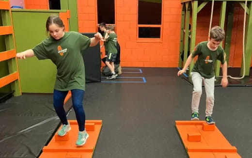 a group of kids playing in a gym