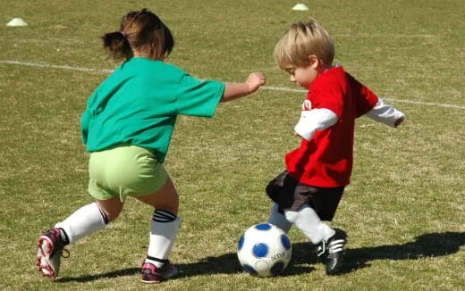 a couple of kids playing football