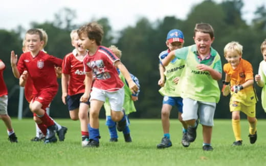 a group of boys playing football