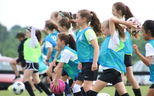 a group of girls playing football