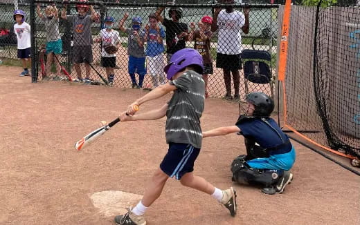 kids playing baseball on a field