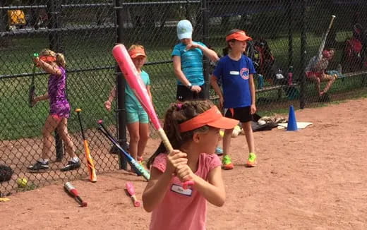 kids playing baseball on a field