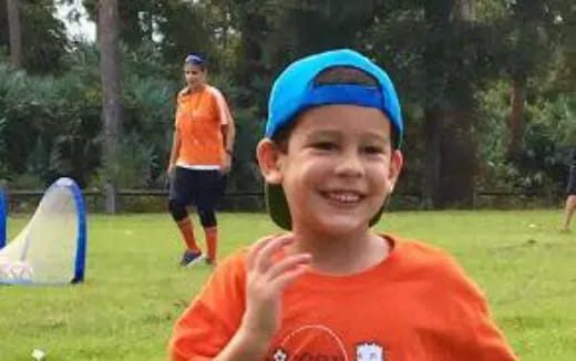 a boy in a blue hat