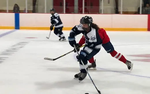 a group of people playing hockey