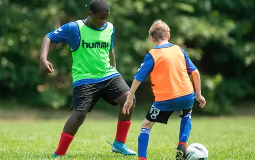 a couple of boys playing football