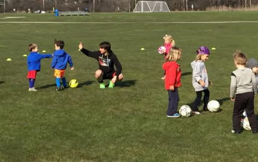 kids playing football on a field