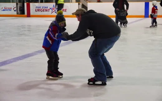 a person and a child on ice