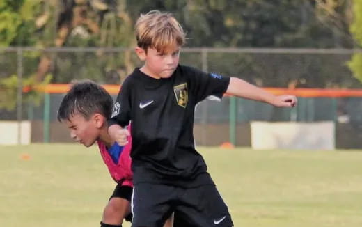 a couple of boys playing football