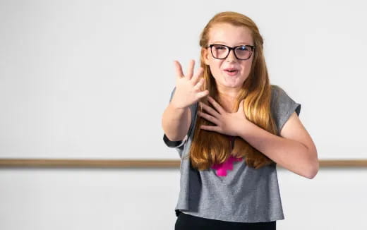 a woman with her hands on her head