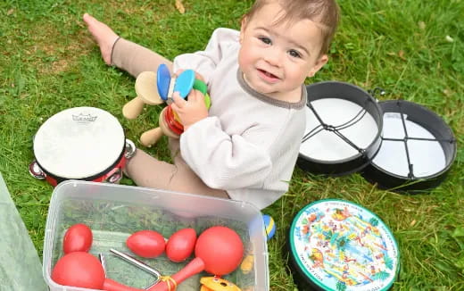 a baby playing with a toy