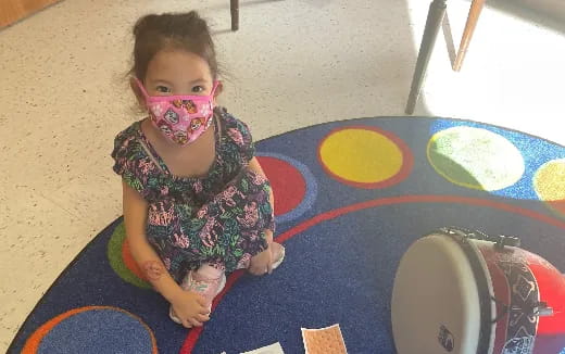 a girl sitting on the floor