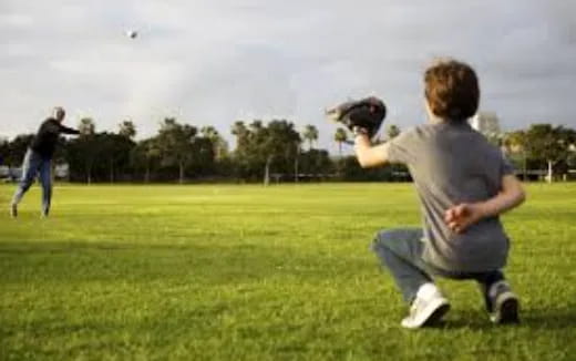 a man catching a baseball