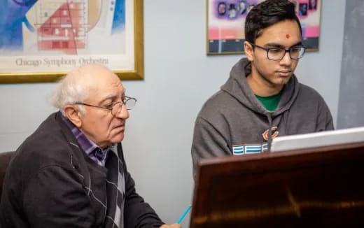 a man sitting next to a man