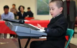 a boy sitting at a desk