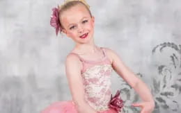 a girl in a pink dress