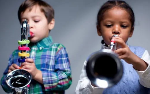 a couple of young boys playing with a toy