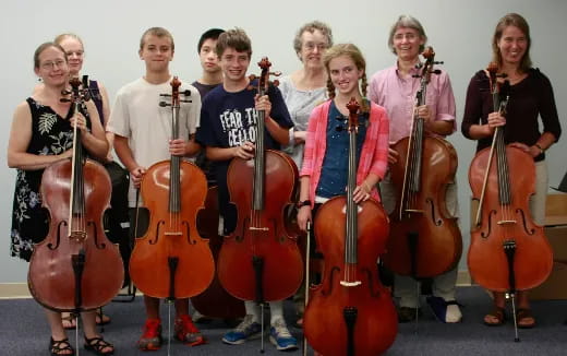 a group of people holding musical instruments