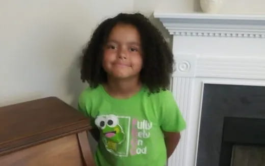 a girl in a green shirt