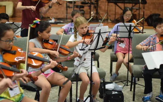 a group of children playing musical instruments