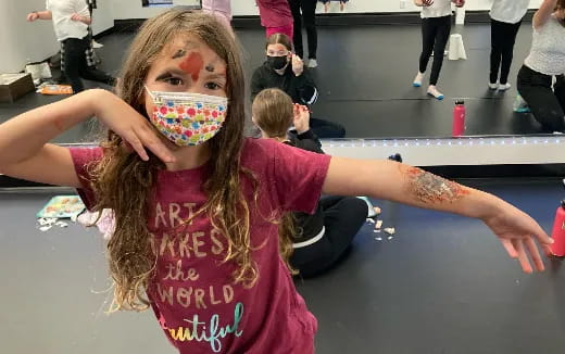 a girl with a face paint