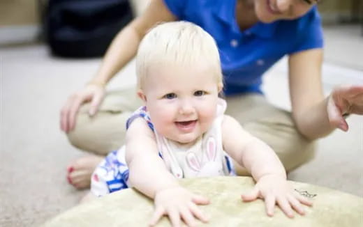a baby crawling on the floor