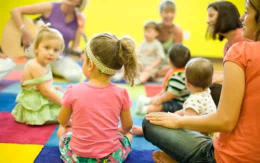 a group of children sitting on the floor