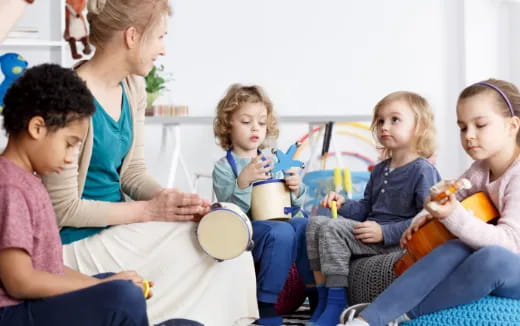 a group of children sitting on a couch