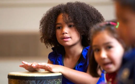 medium shot of kids holding a bowl