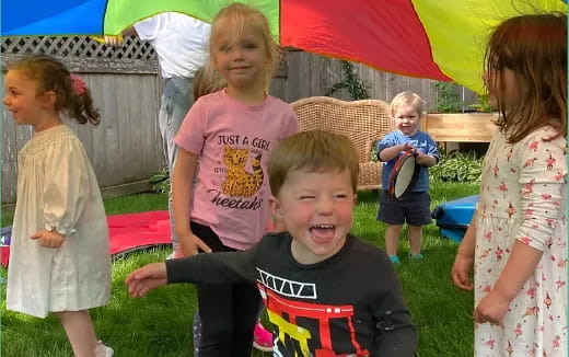 a group of children playing in a yard