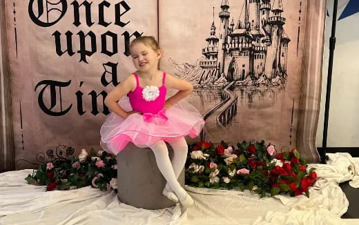 a girl sitting on a chair