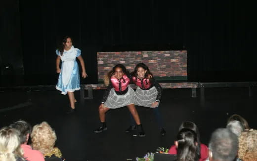a group of women on a stage