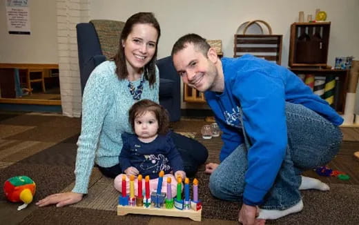 a man and woman with a child