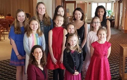 a group of girls posing for a photo