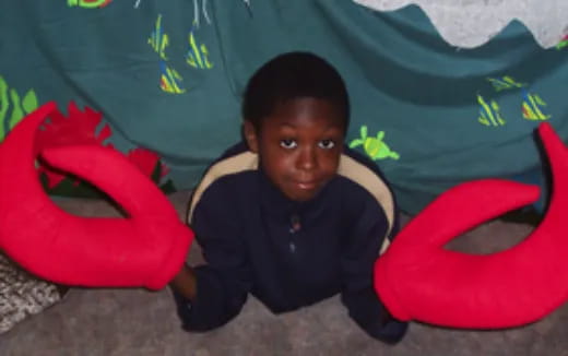 a boy sitting on the floor