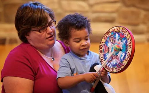 a person and a child painting