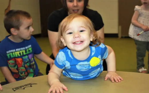 a child sitting at a table