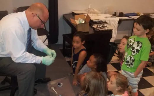 a person and a group of children