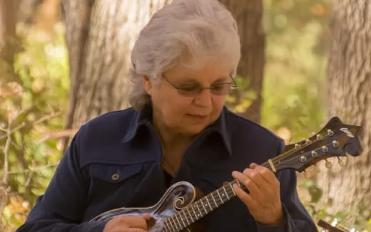a woman playing a guitar
