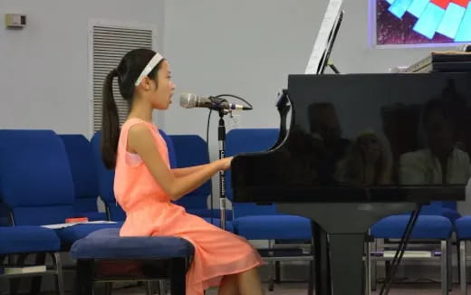 a person singing into a microphone
