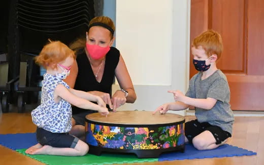 a group of children playing with a toy