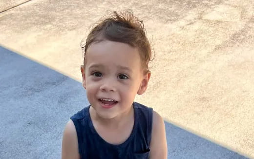 a boy smiling for the camera