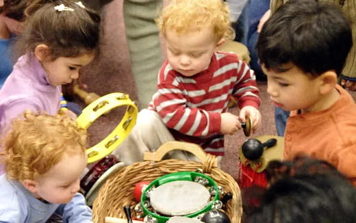 a group of children playing with toys