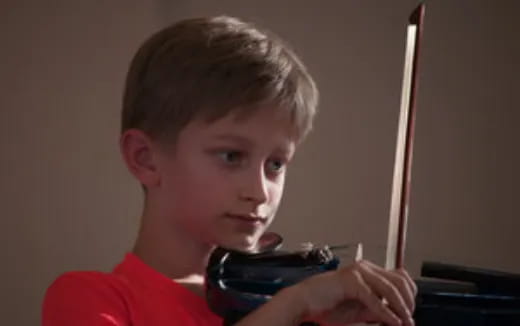 a boy holding a toy gun
