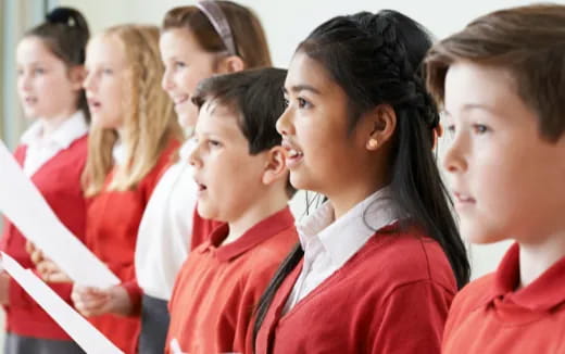 a group of people in red uniforms