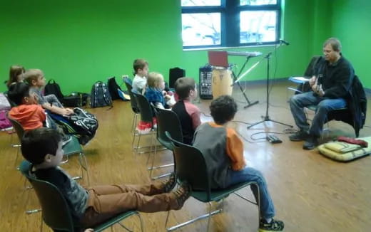 a group of people sitting in chairs