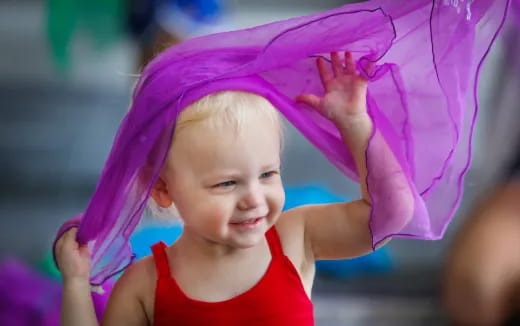 a baby wearing a pink hat