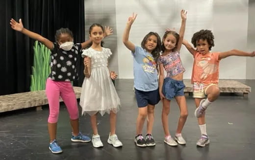 a group of children posing for a photo