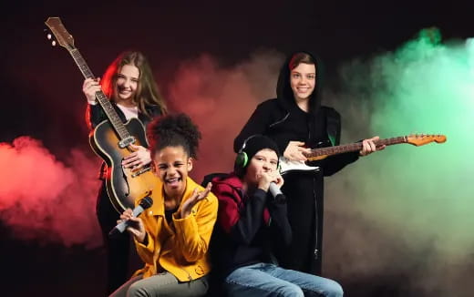 a group of people holding guitars